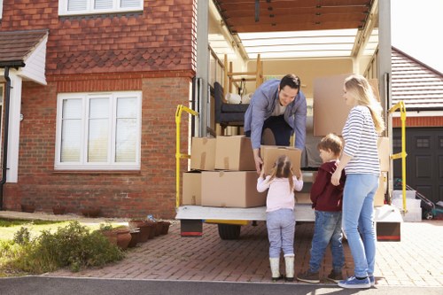 Busy commercial move in Sutton with professionals organizing office equipment