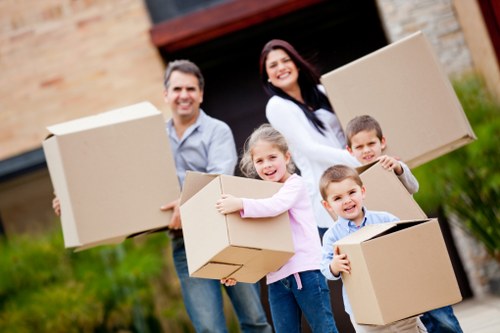 Professional movers handling office items in Sutton with care